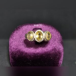 Elegant Silver and Yellow Gemstone Ring